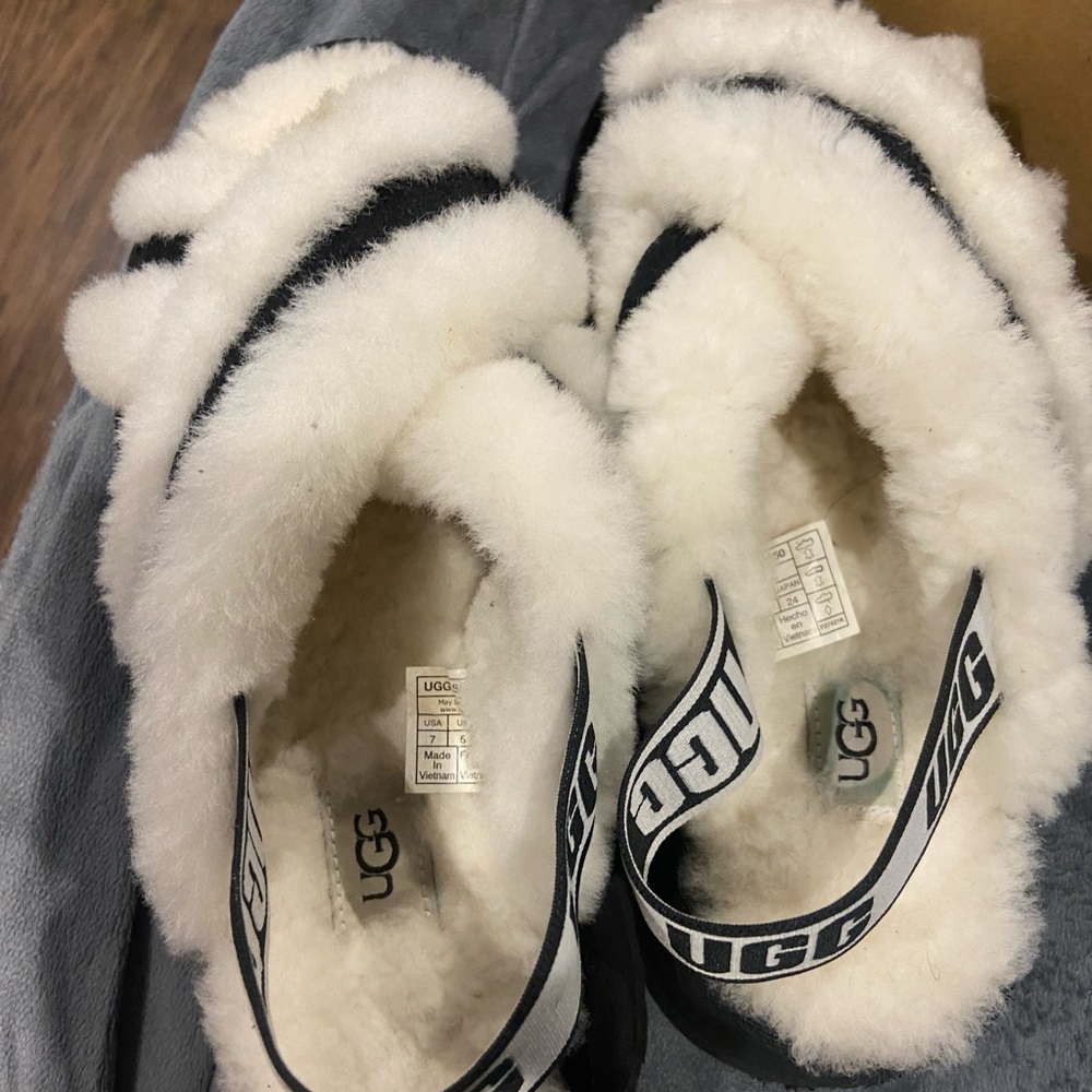 black and white Ugg slippers worn once mint. Condition. Size 7